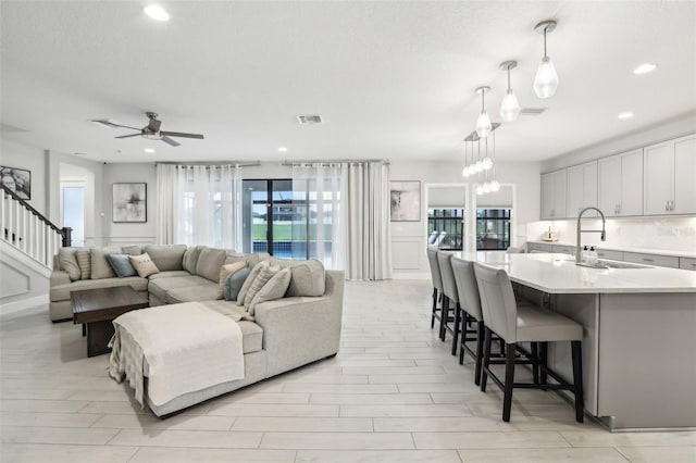 13176 Twin Bridges Dr, Riverview, FL 33579 - living room with recessed lighting, a ceiling fan, and light wood finished floors