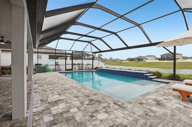 13176 Twin Bridges Dr, Riverview, FL 33579 - swimming pool featuring a patio, glass enclosure, a ceiling fan, and a residential view