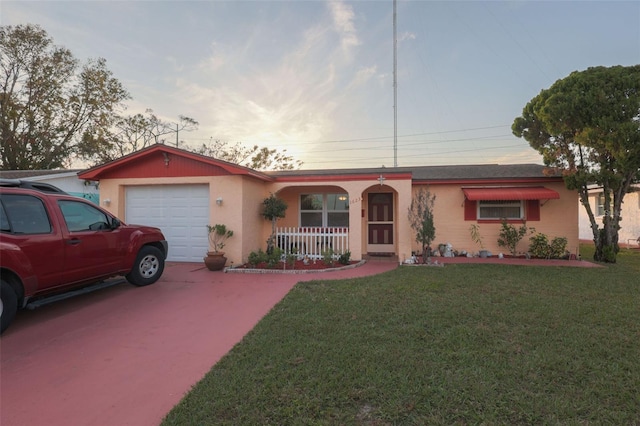 1623 Dartmouth Dr, Holiday, FL 34691 - ranch-style home with an attached garage, a porch, concrete driveway, and a front yard