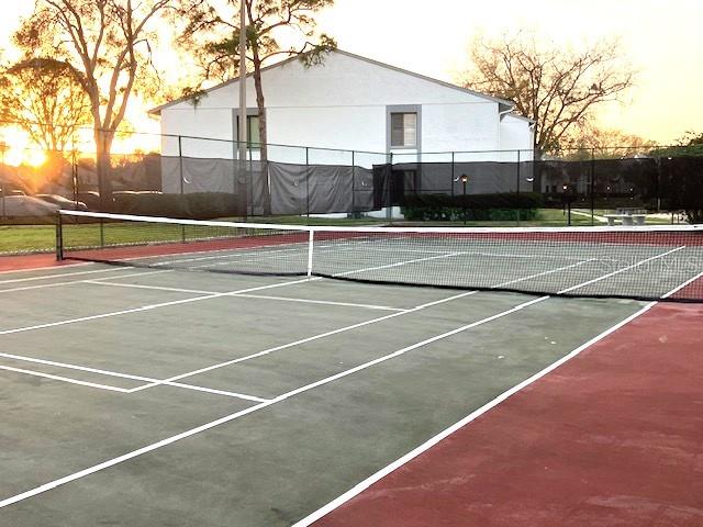 view of sport court with fence