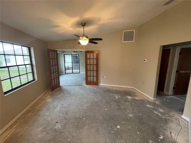 unfurnished room with lofted ceiling, french doors, visible vents, and baseboards