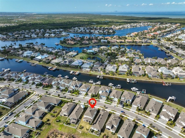 bird's eye view with a residential view and a water view