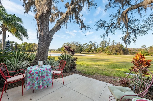 view of patio with a water view