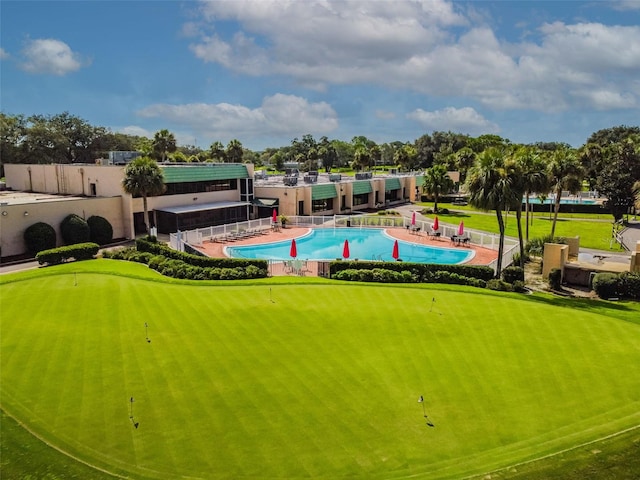 surrounding community with a patio, a pool, and fence