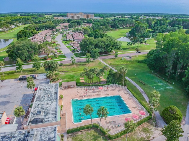 bird's eye view featuring view of golf course and a water view