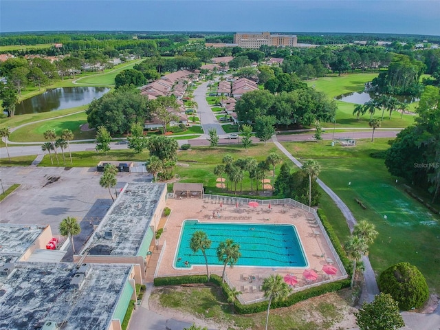 aerial view featuring a water view and golf course view