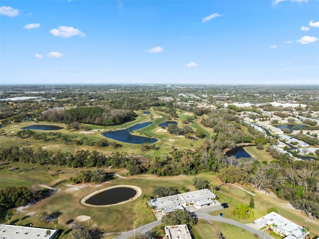 bird's eye view with view of golf course and a water view