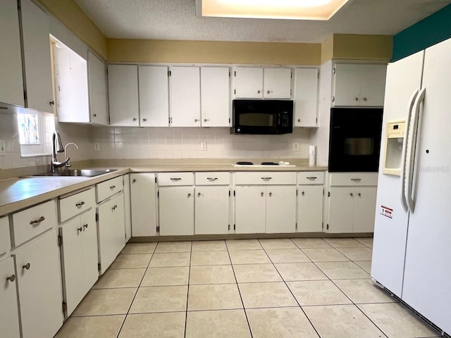 kitchen featuring black appliances, light tile patterned flooring, backsplash, and light countertops