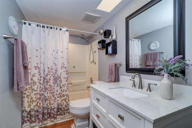 full bathroom with shower / bath combination with curtain, visible vents, vanity, and toilet