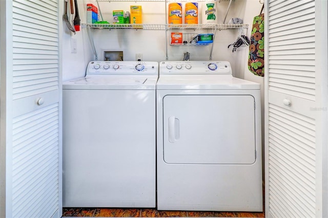 washroom featuring laundry area and washing machine and clothes dryer