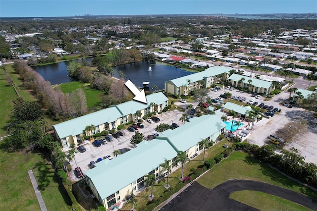 bird's eye view with a residential view and a water view