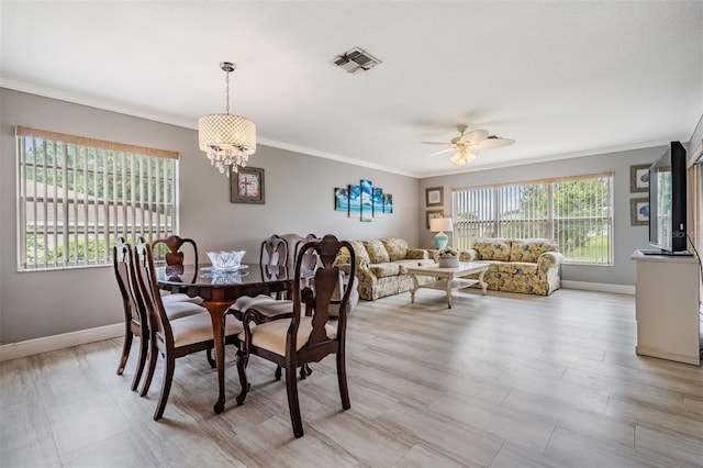 29312 Marker Loop, San Antonio, FL 33576 - dining area featuring baseboards, ornamental molding, a chandelier, and ceiling fan
