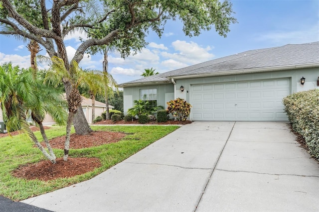 29312 Marker Loop, San Antonio, FL 33576 - view of front of house with an attached garage, stucco siding, driveway, and a front yard