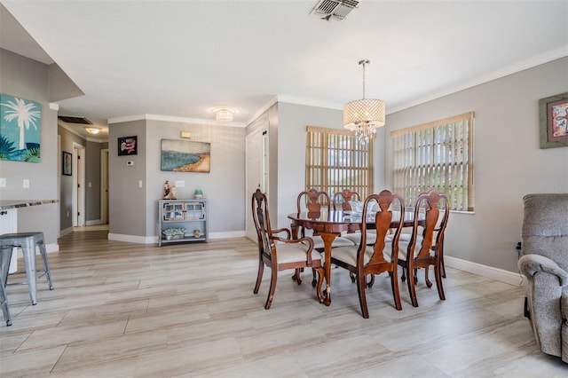 29312 Marker Loop, San Antonio, FL 33576 - dining room with a chandelier, baseboards, and ornamental molding