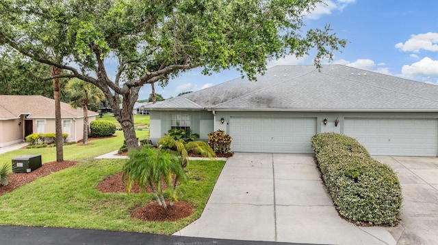 29312 Marker Loop, San Antonio, FL 33576 - ranch-style house featuring a garage, driveway, a front yard, roof with shingles, and stucco siding