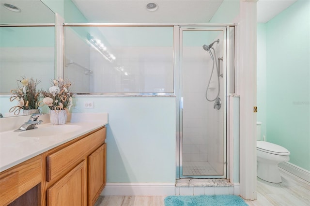 29312 Marker Loop, San Antonio, FL 33576 - bathroom with vanity, a stall shower, toilet, baseboards, and recessed lighting