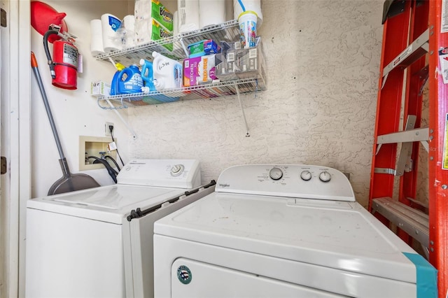 laundry area featuring washer and clothes dryer and laundry area