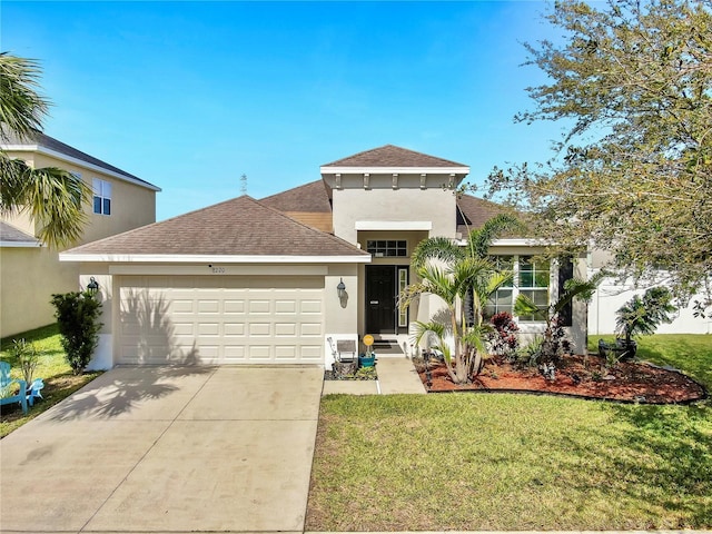 mediterranean / spanish-style house with driveway, roof with shingles, an attached garage, a front lawn, and stucco siding