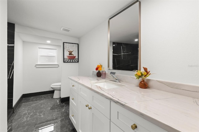 bathroom with baseboards, visible vents, toilet, marble finish floor, and vanity