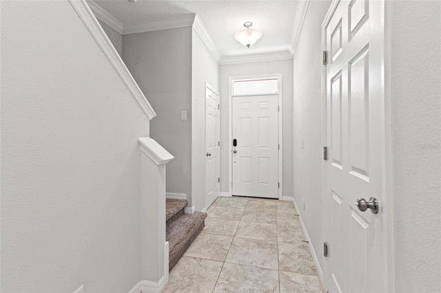 entrance foyer featuring baseboards, light tile patterned floors, stairway, and crown molding