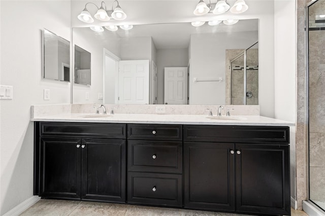 bathroom with double vanity, a stall shower, and a sink