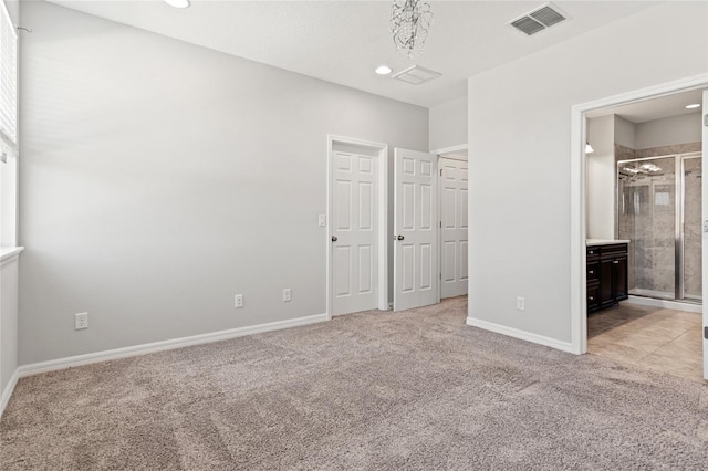 unfurnished bedroom with recessed lighting, light carpet, visible vents, and baseboards