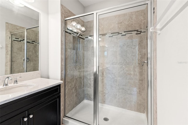 bathroom featuring a stall shower and vanity