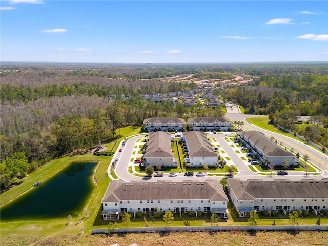 bird's eye view with a water view and a forest view