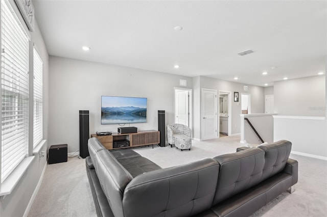 living area featuring recessed lighting, light colored carpet, visible vents, and baseboards