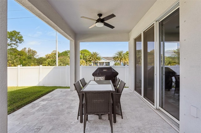 view of patio / terrace with a grill, outdoor dining area, a fenced backyard, and ceiling fan