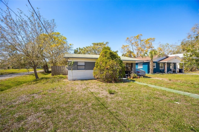 ranch-style house with a front lawn