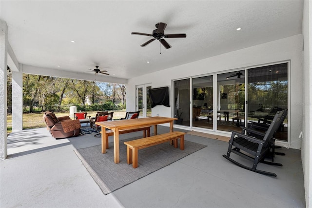 view of patio / terrace with a ceiling fan and outdoor dining space