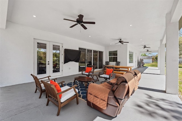 view of patio / terrace with a ceiling fan and french doors