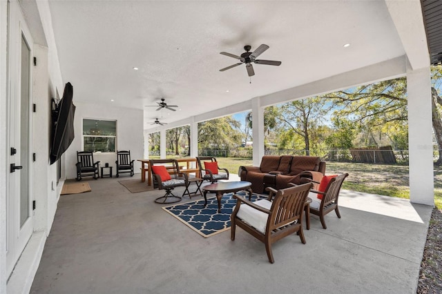 view of patio / terrace featuring ceiling fan, outdoor lounge area, and fence