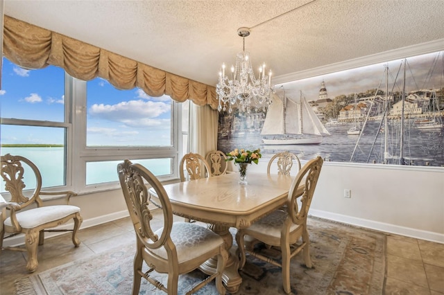 634 Edgewater Dr Unit 744, Dunedin, FL 34698 - tiled dining space featuring a textured ceiling and a chandelier