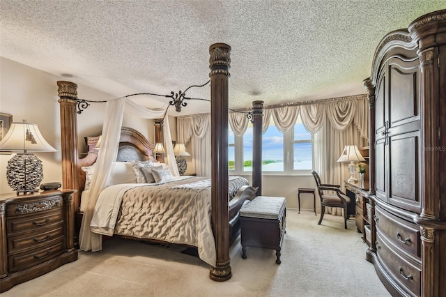 634 Edgewater Dr Unit 744, Dunedin, FL 34698 - bedroom featuring light colored carpet and a textured ceiling