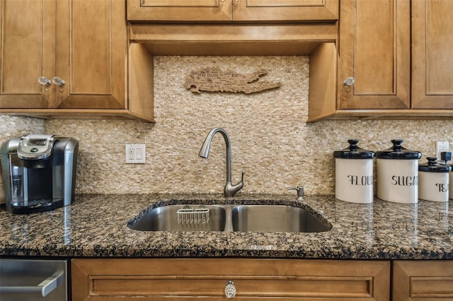 634 Edgewater Dr Unit 744, Dunedin, FL 34698 - kitchen with decorative backsplash, brown cabinetry, and dark stone counters
