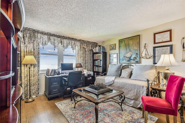 634 Edgewater Dr Unit 744, Dunedin, FL 34698 - office area with a textured ceiling and wood finished floors