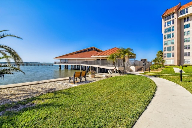634 Edgewater Dr Unit 744, Dunedin, FL 34698 - dock area with a water view and a yard