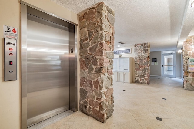 634 Edgewater Dr Unit 744, Dunedin, FL 34698 - hallway with elevator, a textured ceiling, and tile patterned floors