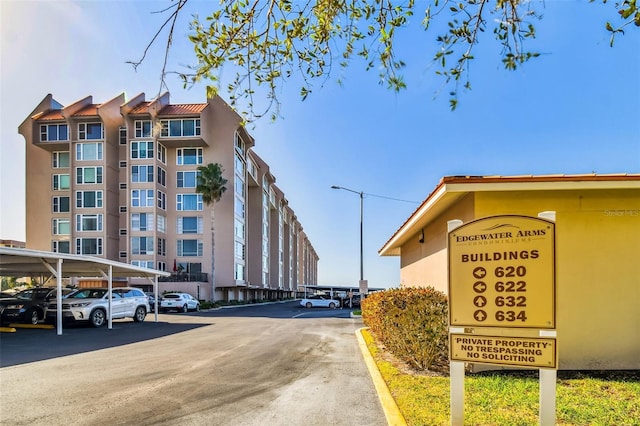 634 Edgewater Dr Unit 744, Dunedin, FL 34698 - view of property featuring covered parking