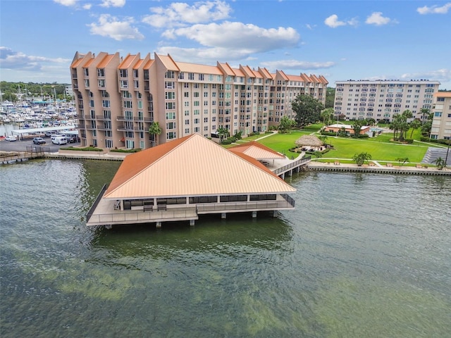 634 Edgewater Dr Unit 744, Dunedin, FL 34698 - dock area featuring a water view and a yard