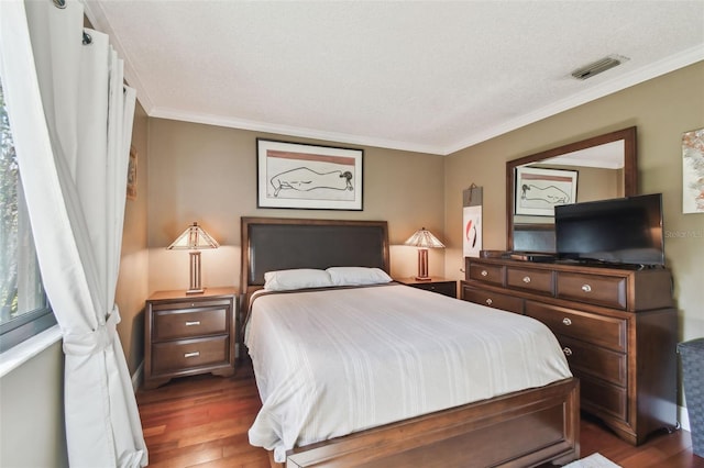 bedroom with crown molding, visible vents, and dark wood-type flooring