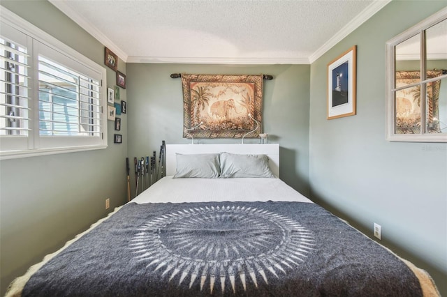 bedroom with ornamental molding and a textured ceiling