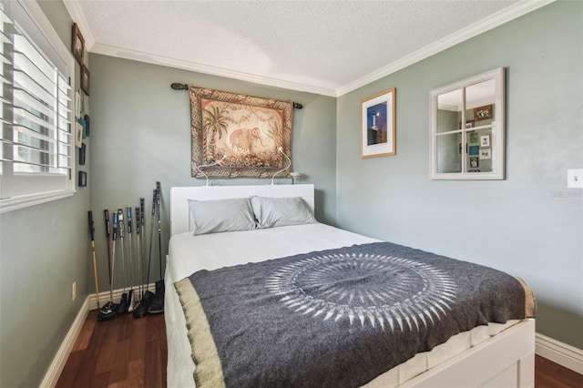 bedroom featuring a textured ceiling, dark wood finished floors, and crown molding