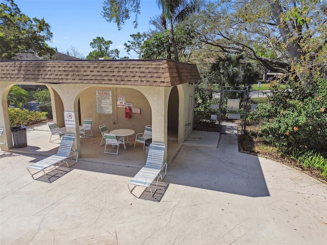 view of patio / terrace featuring fence