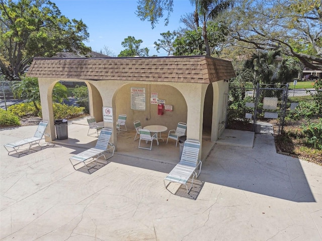 view of patio / terrace featuring fence