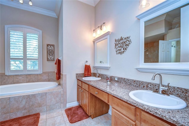 full bath with a bath, tile patterned flooring, ornamental molding, and a sink