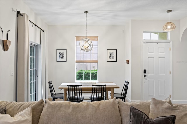 dining room featuring baseboards