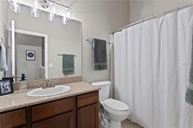 bathroom featuring toilet, a shower with curtain, and vanity